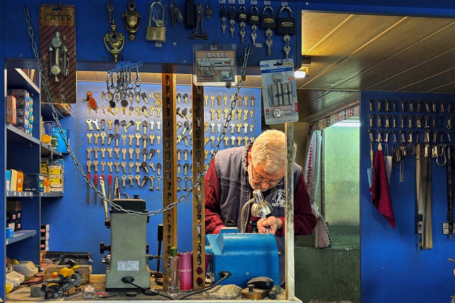 Master locksmith at work in shop
