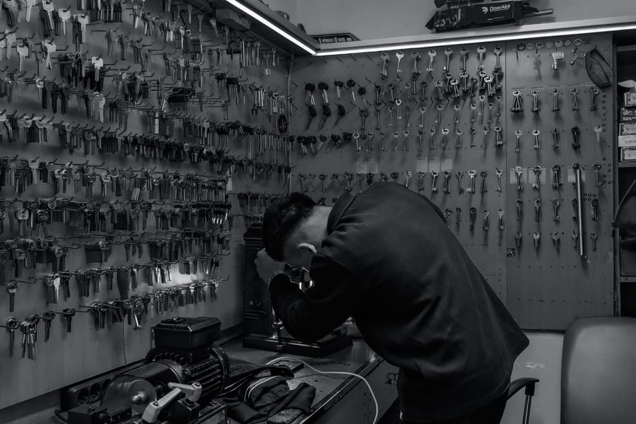 Licensed locksmith servicing a residential door lock